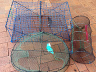 A collection of three different seized illegal recreational fish traps